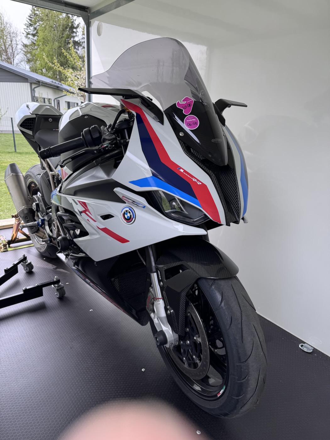 The bike seen from the front, strapped into the enclosed trailer
